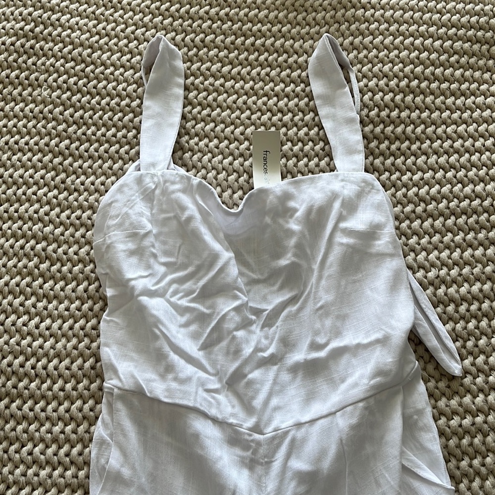 Francesca’s white jumpsuit